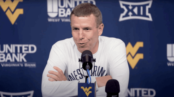 WVU Basketball HC Ross Hodge press conference white shirt