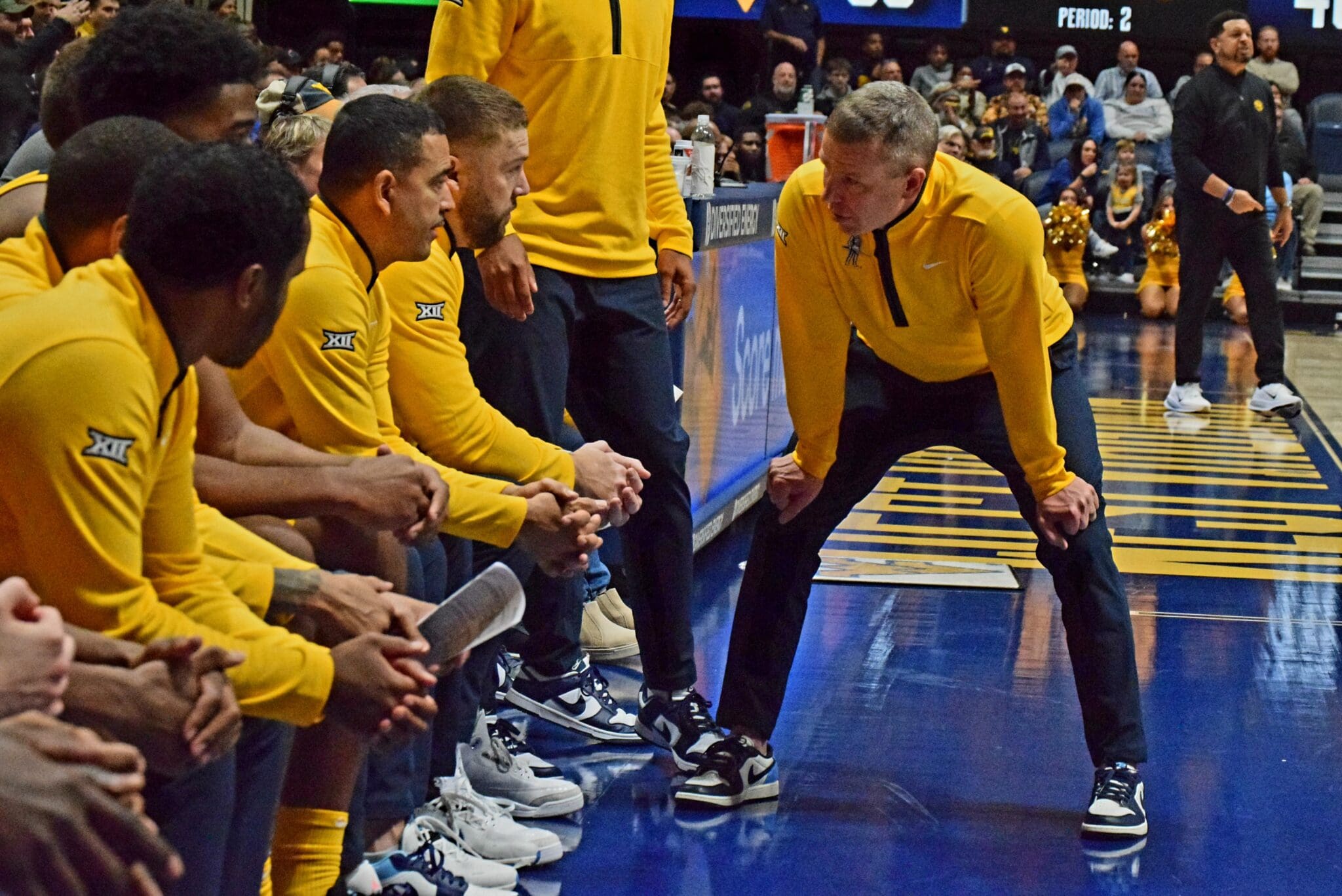 WVU Basketball HC Ross Hodge and staff