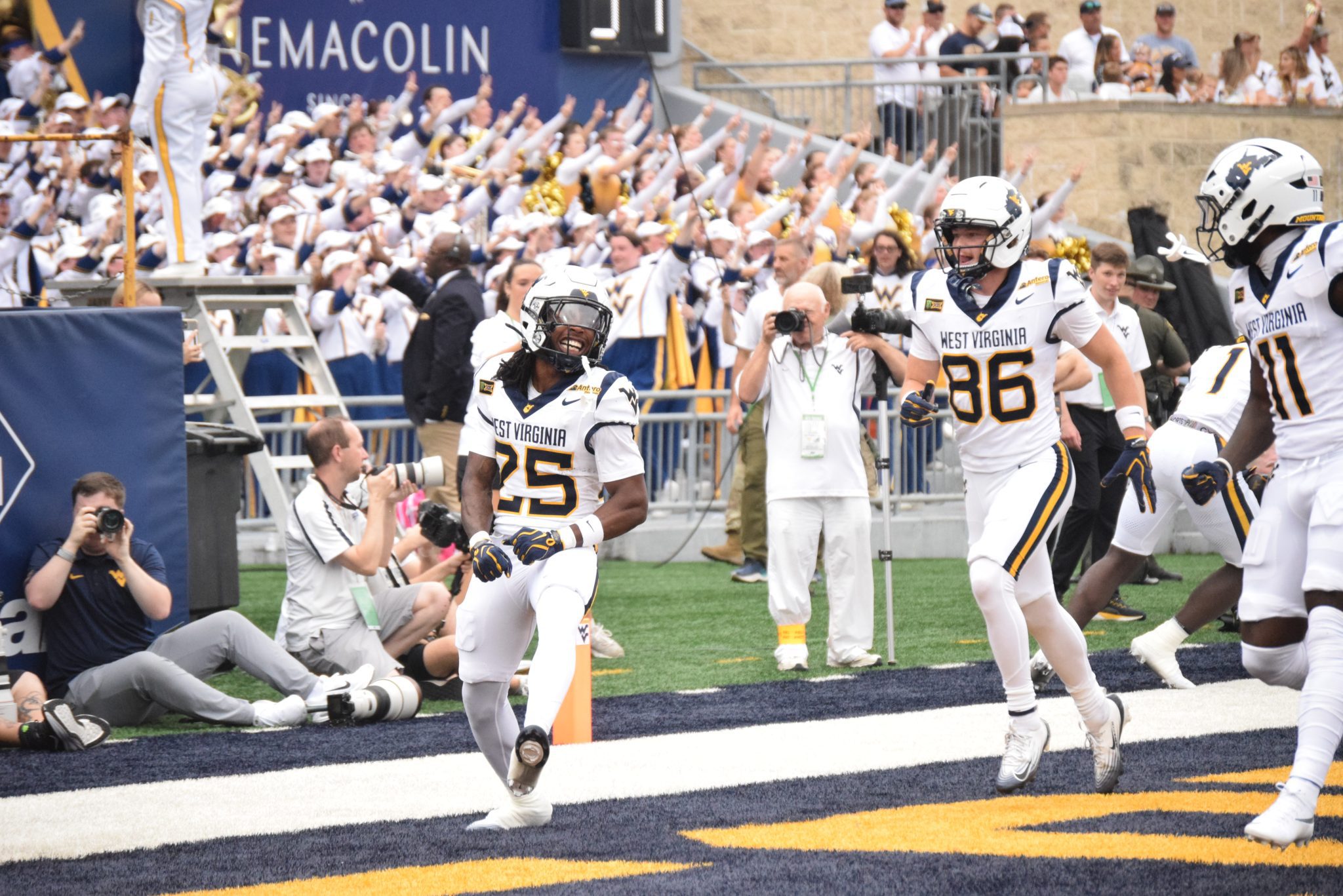 WVU Football players celebrating